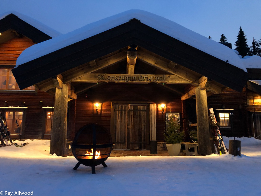 A warm entrance to a bar at the foot of the slopes